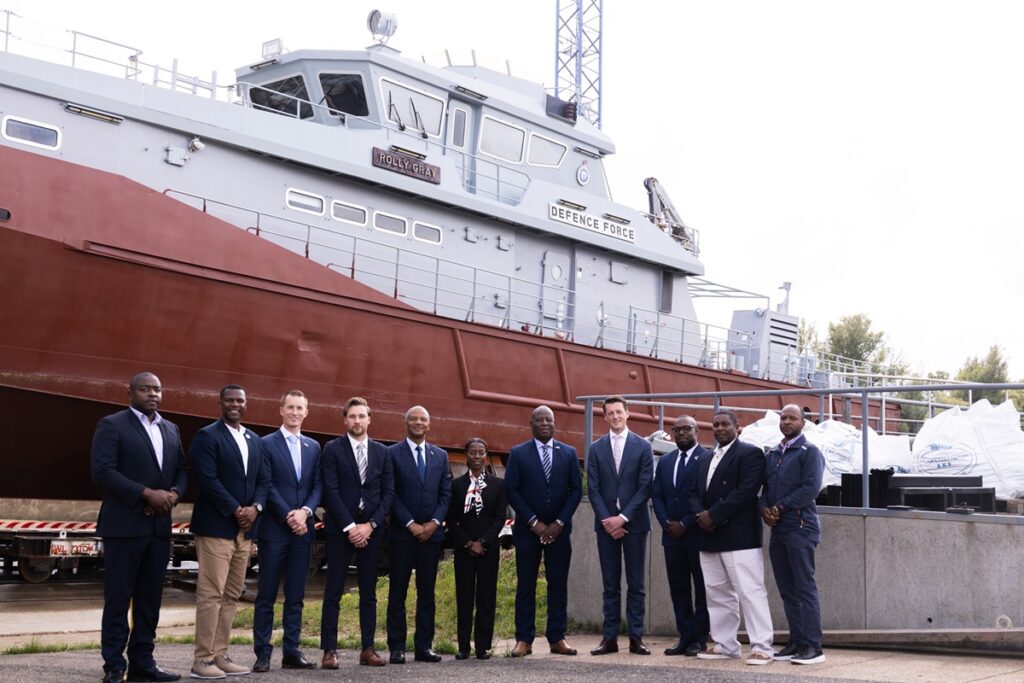 Representatives from Damen Shipyards and the RBDF in front of the patrol vessel ‘Rolly Gray’ in Gorinchem