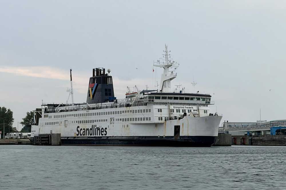 The ‘Kronprins Frederik’ ferry, with a harbour area in the background