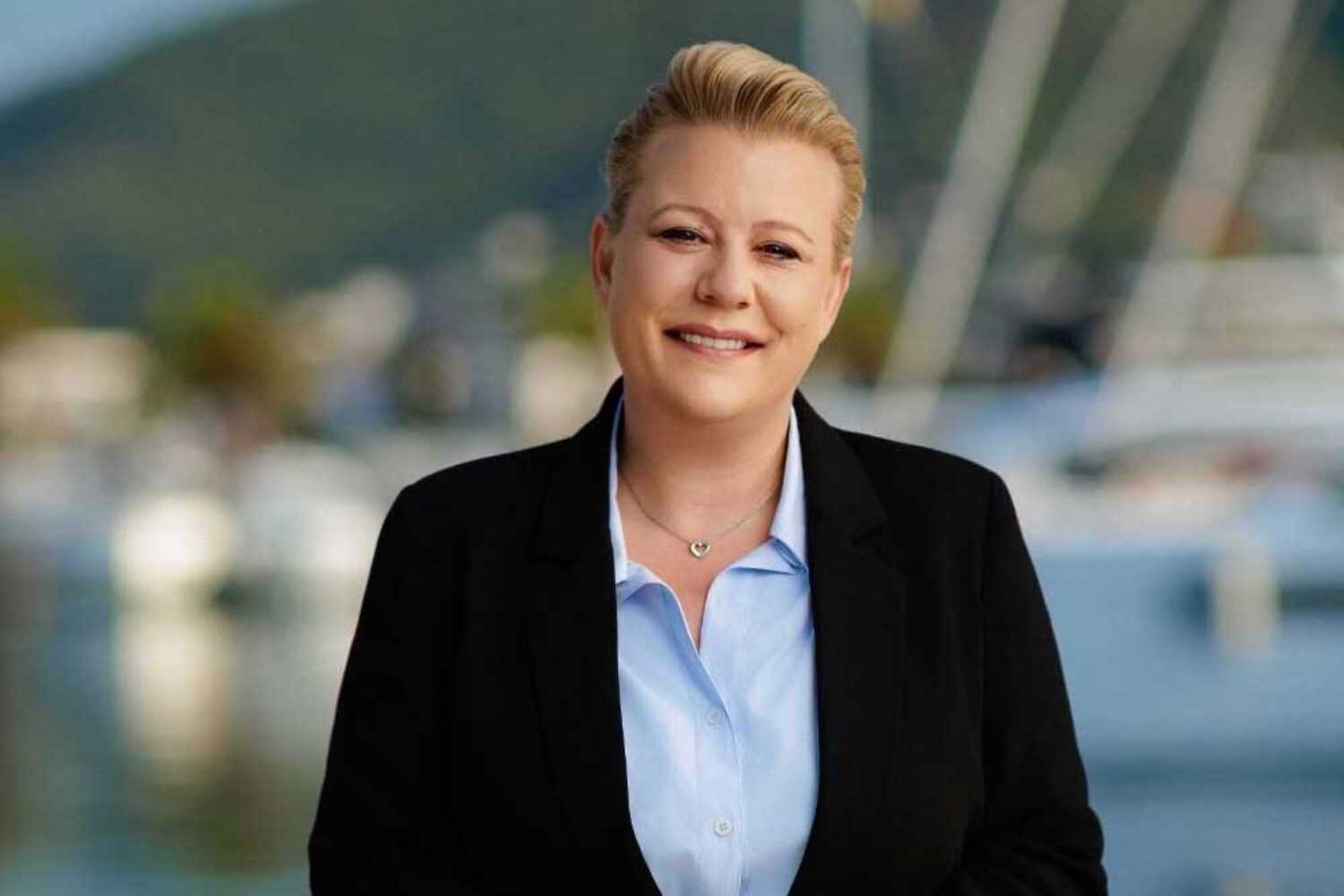Andrea Eggers, a woman in a suit