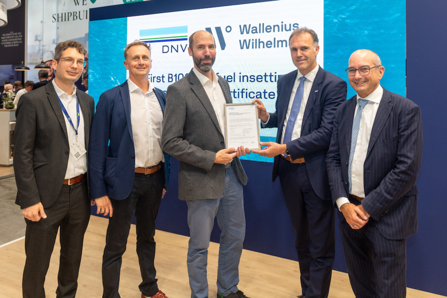 Presentation of the certificate at SMM 2024. from left: Guilherme Romar Borzacchiello, Environmental Engineer at DNV; Benjamin Witt, Principal Environmental Compliance Director at DNV; Joris Vernhaag, Senior Manager High & Heavy Breakbulk Germany at Wallenius Wilhelmsen Ocean AS; Morten Lerø, Managing Director Advisory at DNV; Olaf Doerk, Head of the Advisory Center Hamburg at DNV.