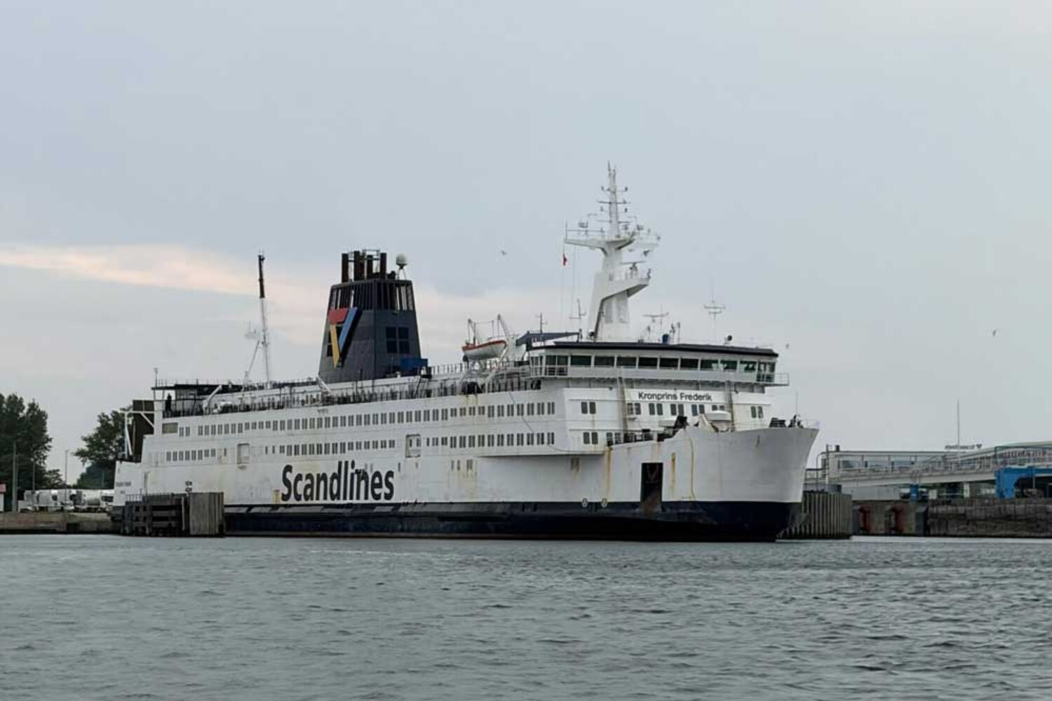 The ‘Kronprins Frederik’ ferry, with a harbour area in the background