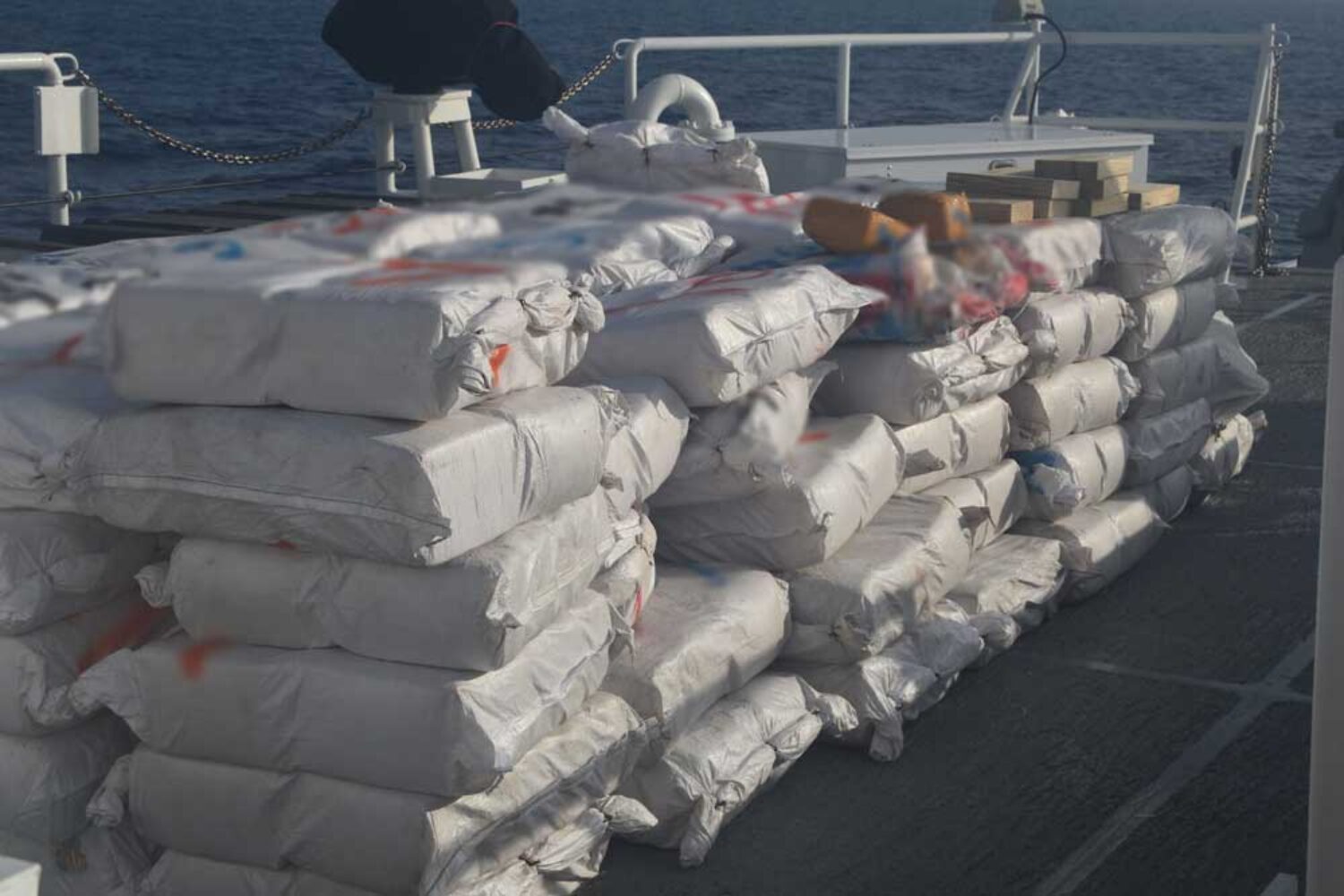 Stacked plastic bags on a coastguard boat