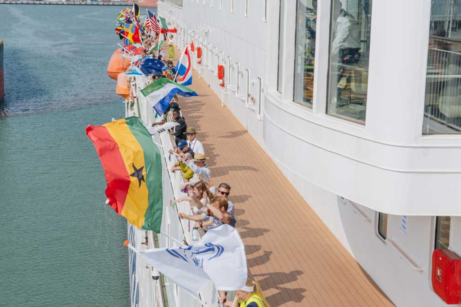 People on board a ship; the Ghanaian flag can be seen
