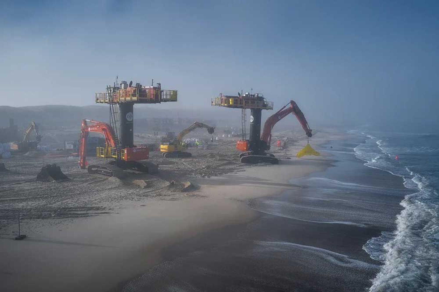 Excavators install deep-sea cable for the Danish offshore wind farm Thor