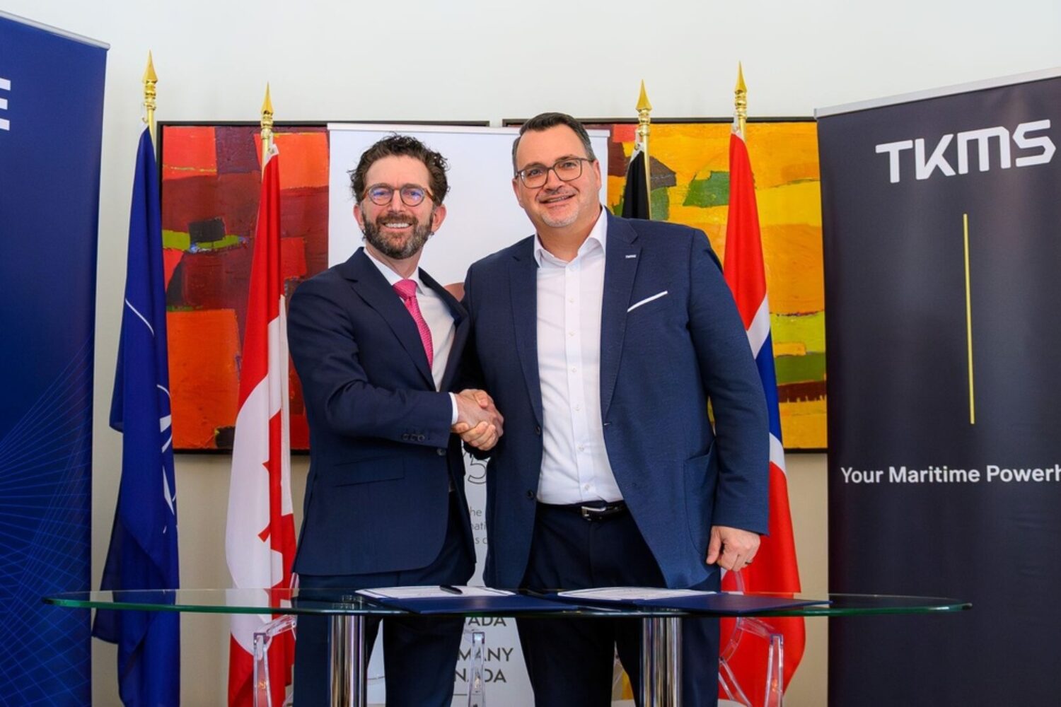 Two men from companies shaking hands